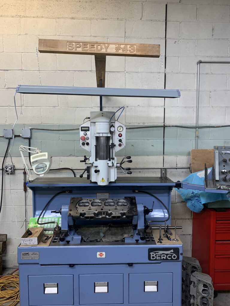 Cylinder head loaded on a Berco valve seat cutting machine